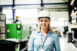 industrial woman engineer standing in a factory